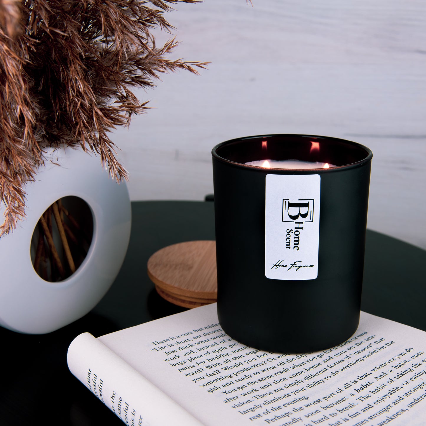 Burning scented candle on the coffee table