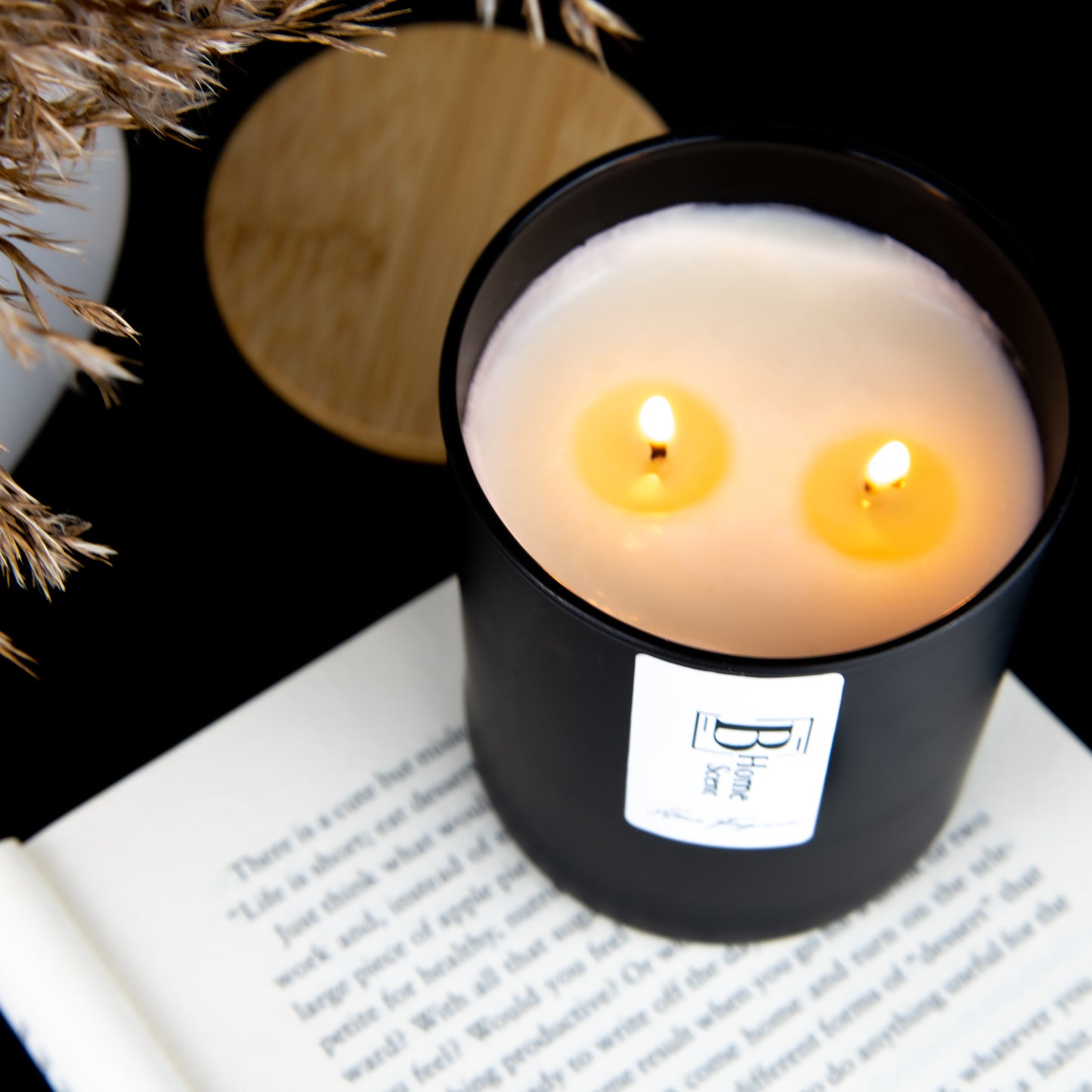 2 wicks Burning scented candle on the coffee table