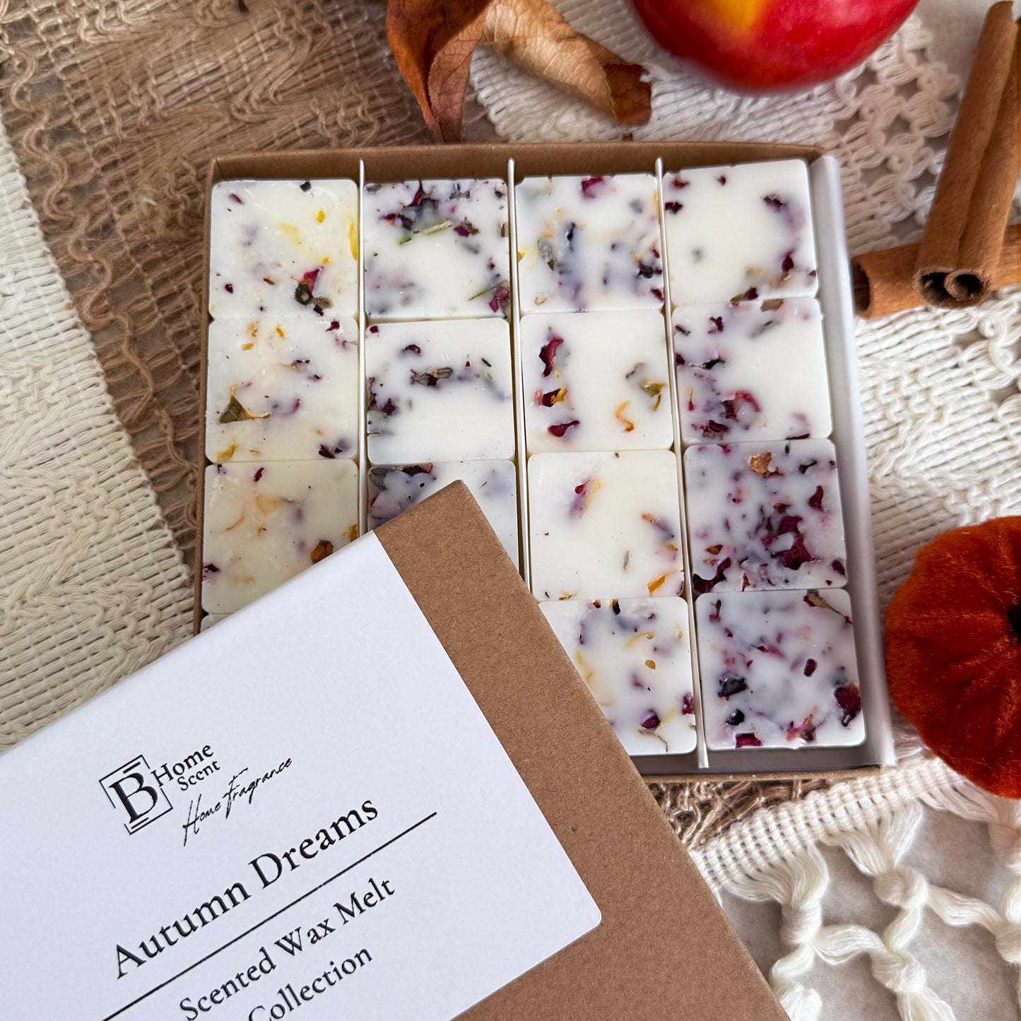 BHOMESCENT Autumn Dreams wax melt collection in kraft box, featuring botanical soy wax melts with dried petals, styled with apple, cinnamon sticks, and autumn décor