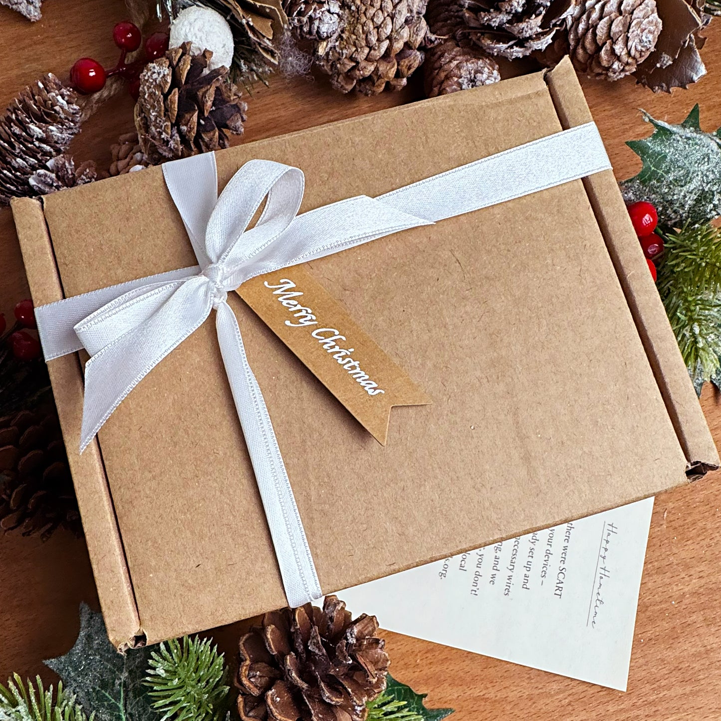 Christmas candle gift box with white ribbon and gift tag