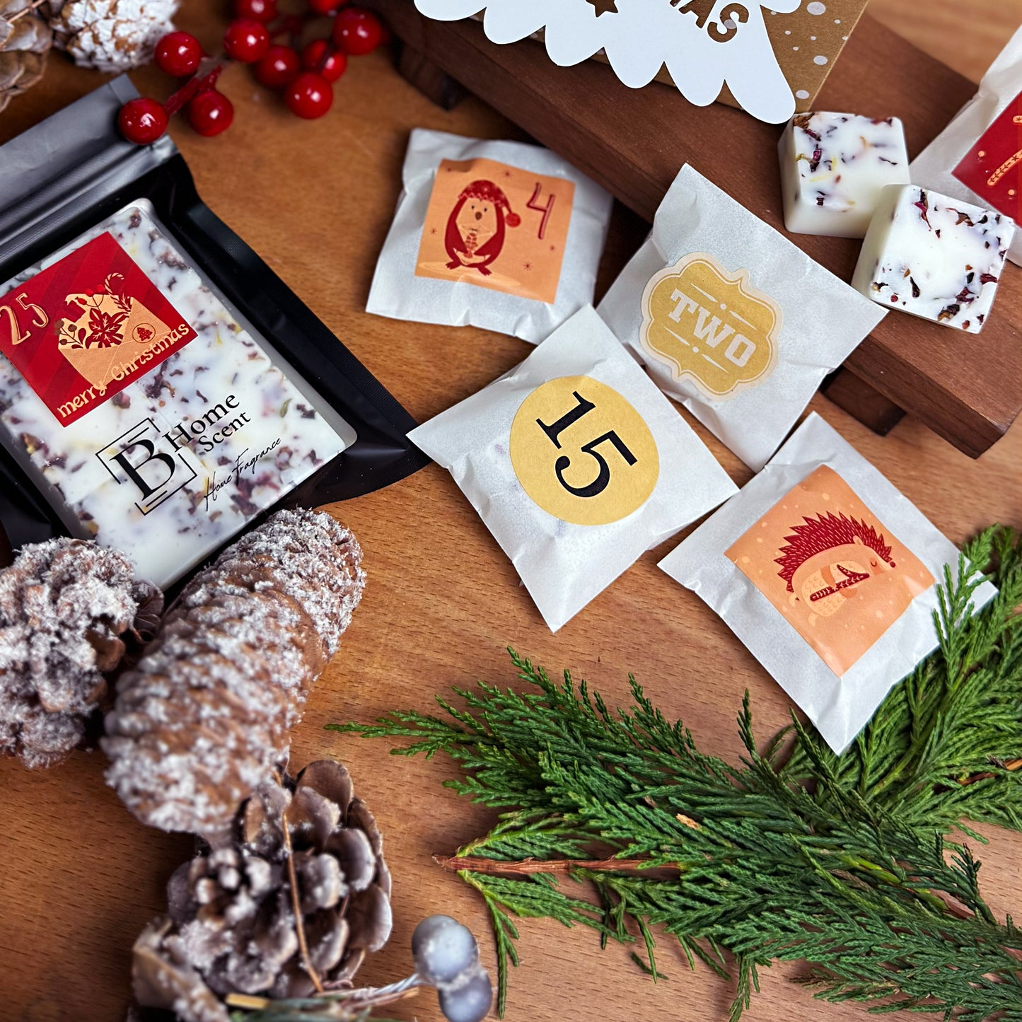 Wax melt advent calendar with numbered white bags on a wooden surface with decorative elements