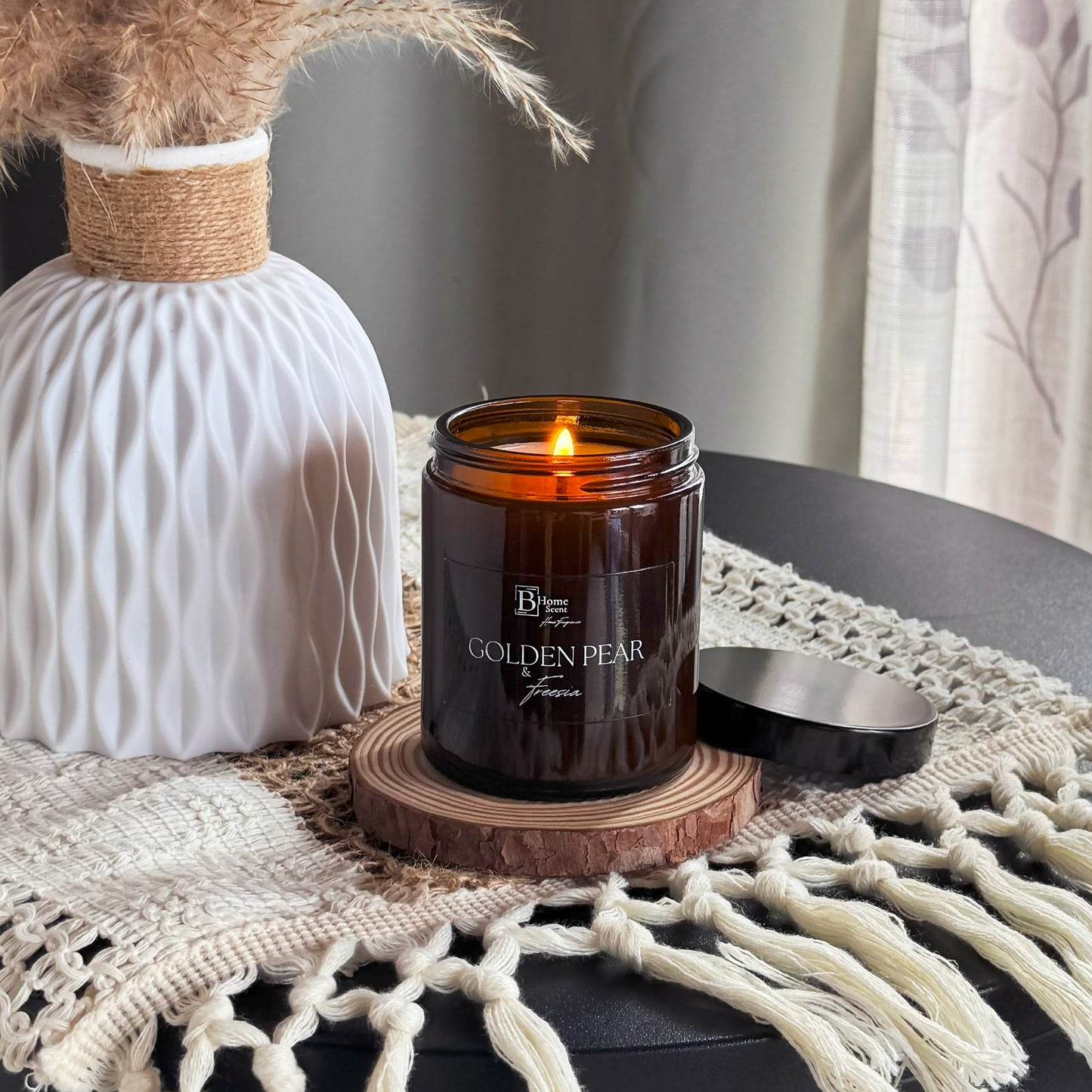 Golden Pear and Freesia Scented Candle UK in amber jar on table, handmade home fragrance