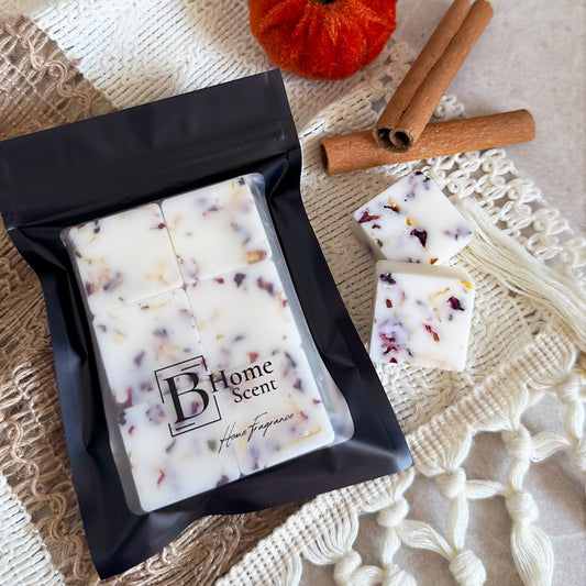Pumpkin Spice Latte botanical wax melts with dried rose and calendula petals in black resealable packaging, styled with cinnamon sticks and autumn décor.