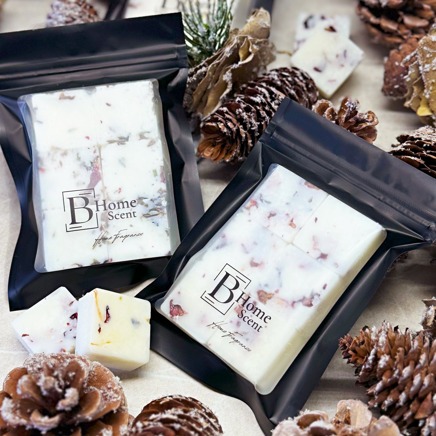 Nutcracker wax melt snap bars in black packaging surrounded by pinecones and winter decorations.