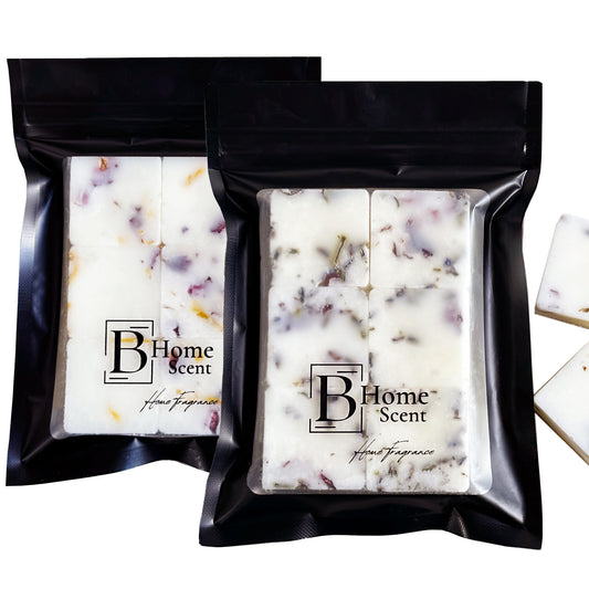 Two packages of B Home Scent scented wax melts with visible branding on a white background