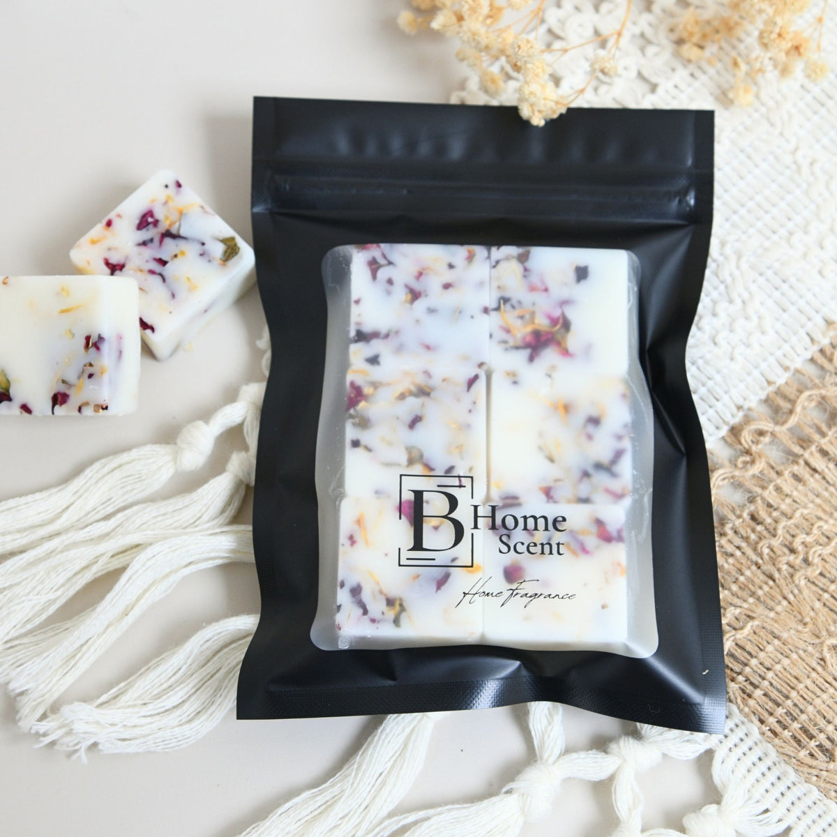 orange and bergamot wax melts in a black pouch. wax melts uk with dried botanical