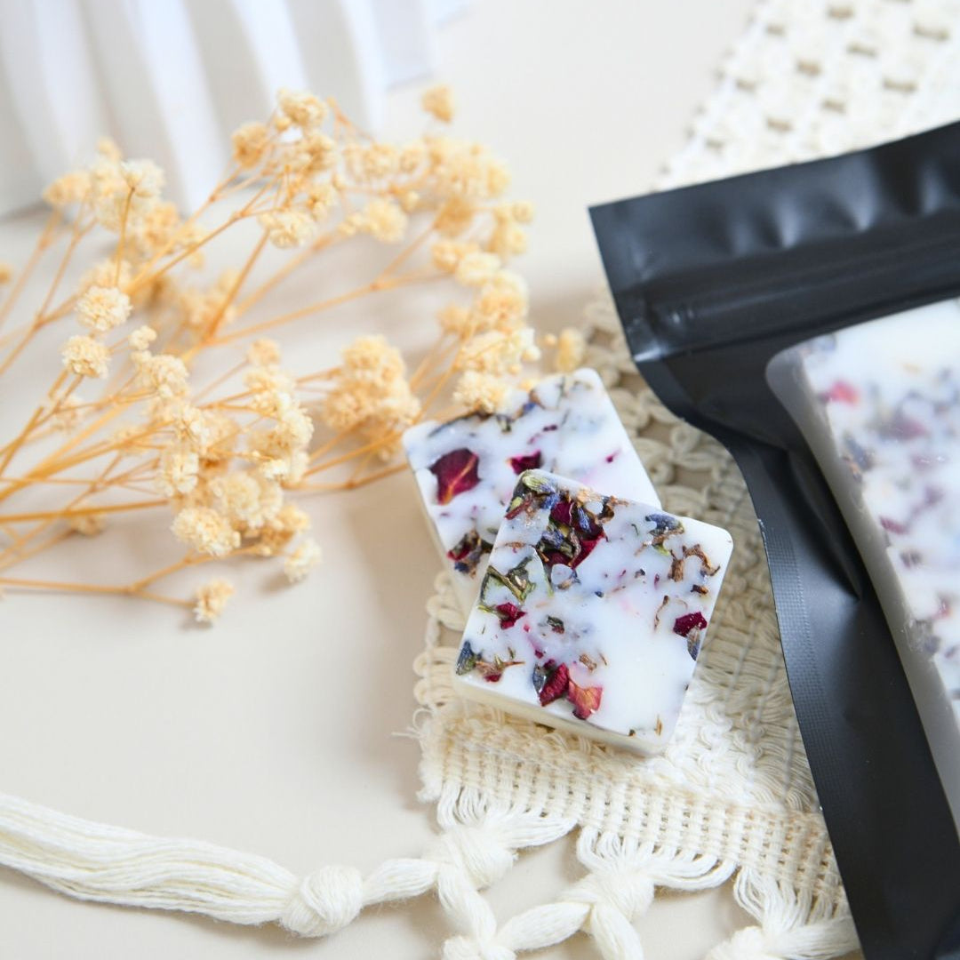 Frankincense Wax Melts displayed with dried flowers and packaging, showcasing their unique design and fragrant appeal.