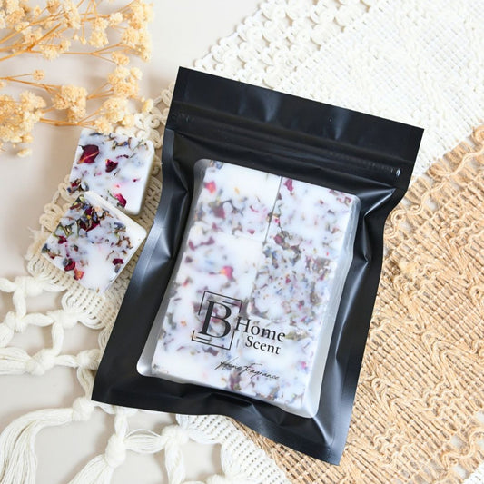 Frankincense Wax Melts in a decorative black package with floral accents, perfect for enhancing home fragrance.